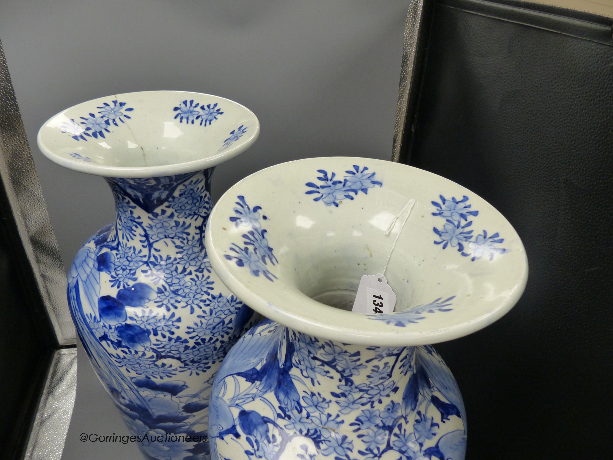 A pair of large Japanese blue and white vases (one a.f.), 60cm high